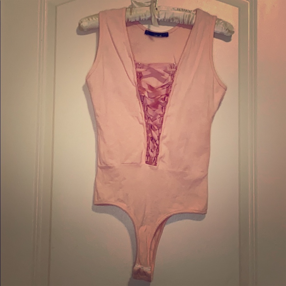 Pink bodysuit with ribbon crossup